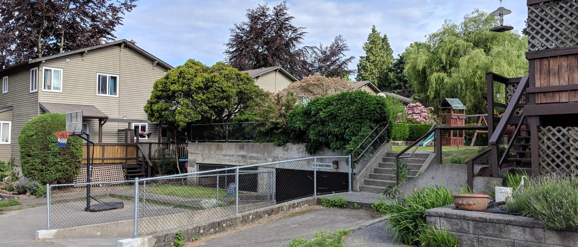 Community playground and shared outdoor spaces with basketball hoop